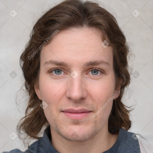 Joyful white young-adult female with medium  brown hair and blue eyes