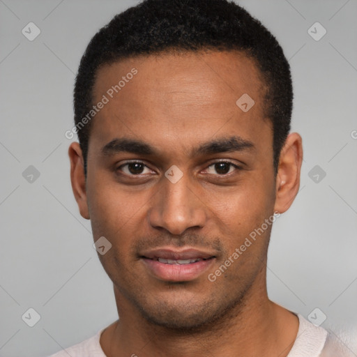 Joyful black young-adult male with short  brown hair and brown eyes