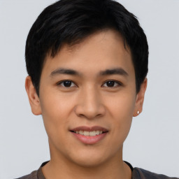 Joyful asian young-adult male with short  black hair and brown eyes