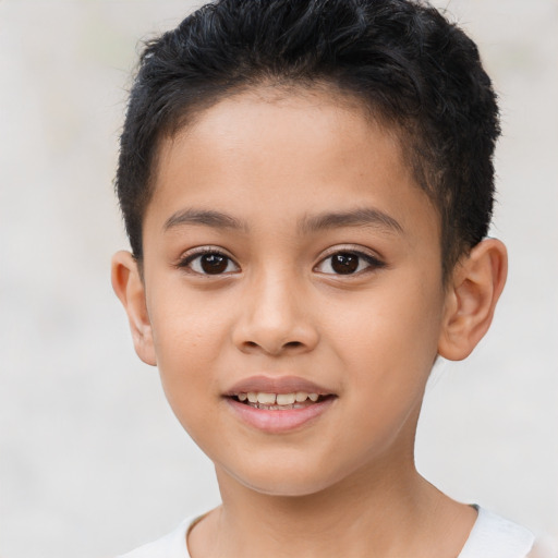 Joyful latino child female with short  brown hair and brown eyes