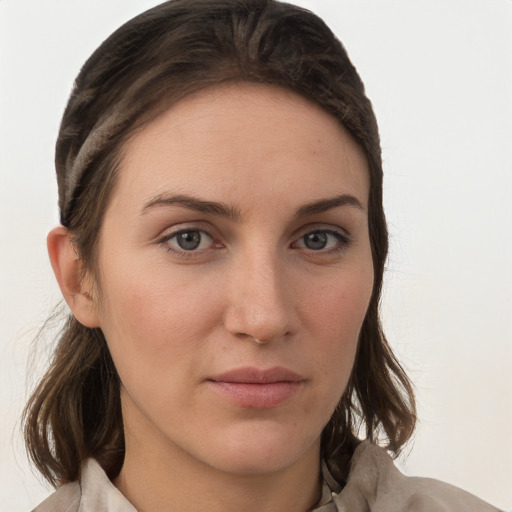 Neutral white young-adult female with medium  brown hair and grey eyes