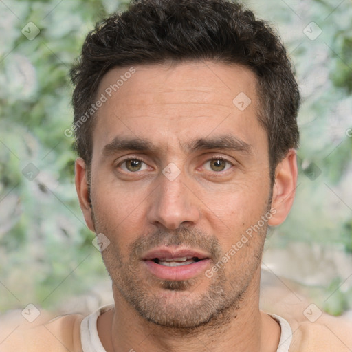 Joyful white adult male with short  brown hair and brown eyes