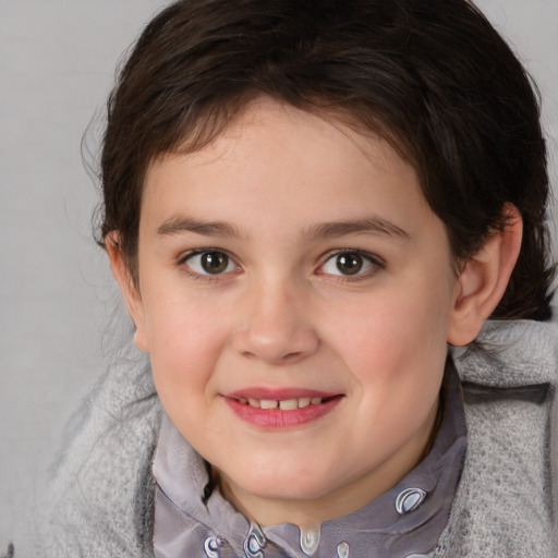 Joyful white child female with short  brown hair and brown eyes