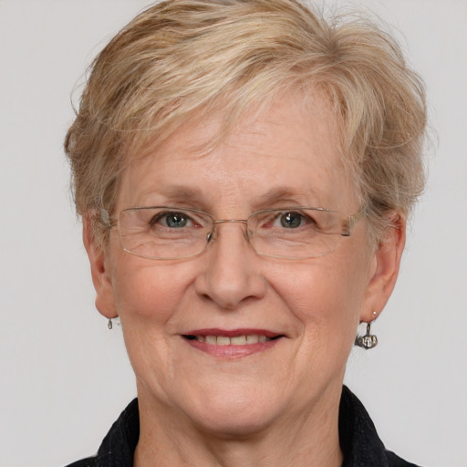 Joyful white middle-aged female with medium  brown hair and grey eyes