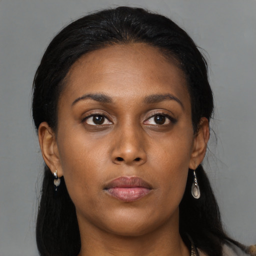 Neutral black young-adult female with long  black hair and brown eyes
