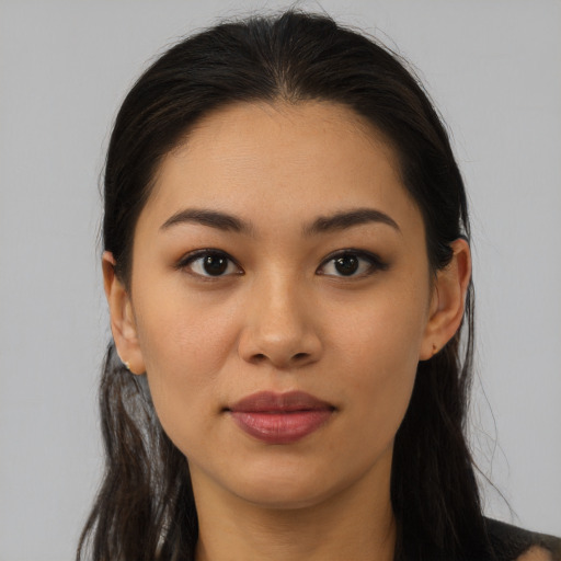 Joyful white young-adult female with long  brown hair and brown eyes