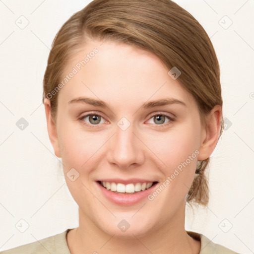 Joyful white young-adult female with medium  brown hair and green eyes