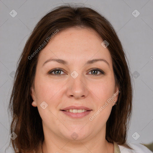 Joyful white adult female with medium  brown hair and grey eyes