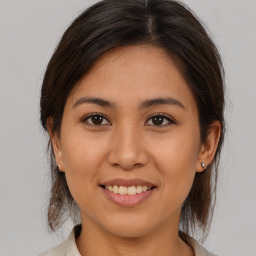 Joyful asian young-adult female with medium  brown hair and brown eyes