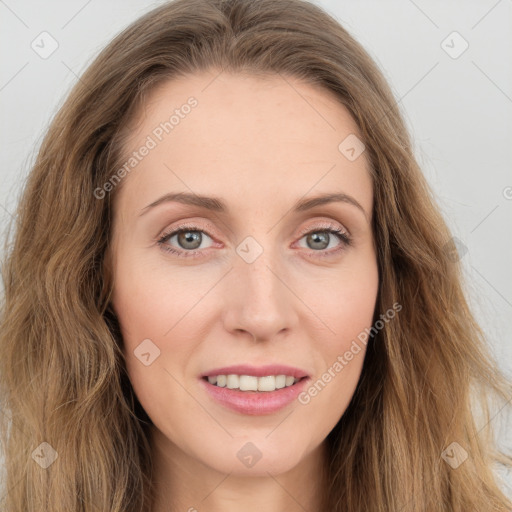 Joyful white young-adult female with long  brown hair and blue eyes