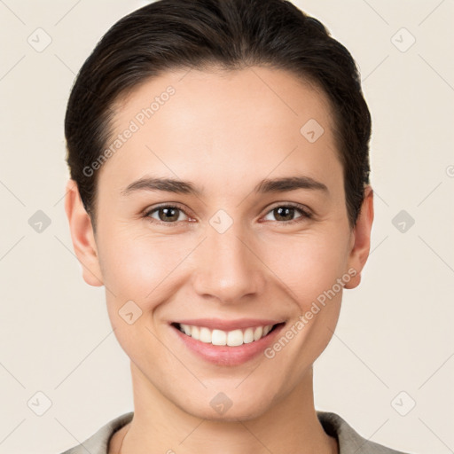 Joyful white young-adult female with short  brown hair and brown eyes