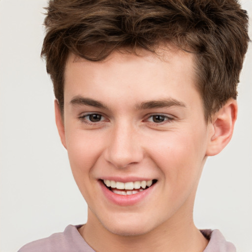 Joyful white child male with short  brown hair and brown eyes