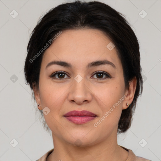 Joyful latino young-adult female with medium  brown hair and brown eyes