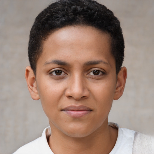 Joyful latino young-adult female with short  brown hair and brown eyes