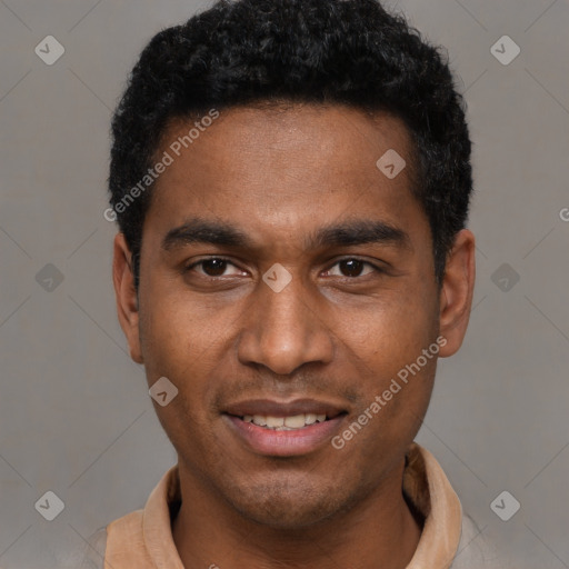 Joyful black young-adult male with short  black hair and brown eyes