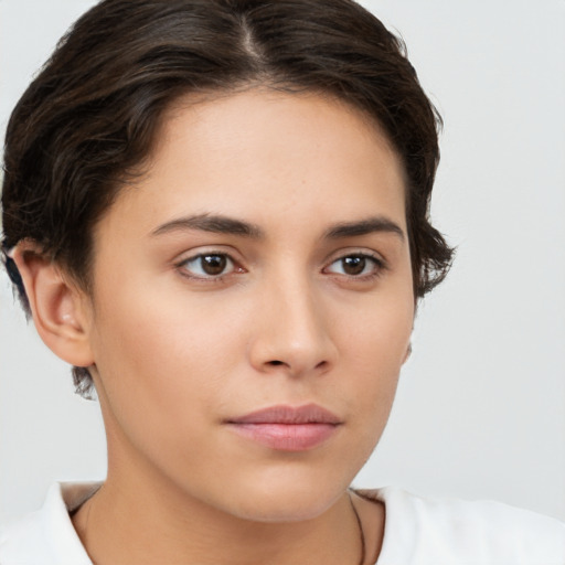 Neutral white young-adult female with medium  brown hair and brown eyes