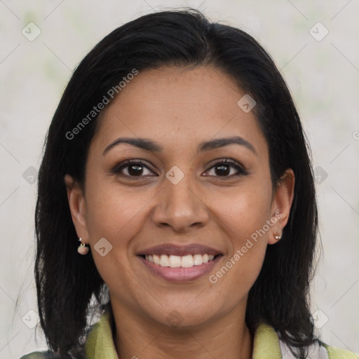 Joyful latino young-adult female with medium  brown hair and brown eyes