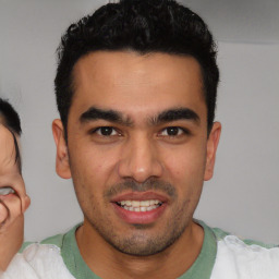 Joyful white young-adult male with short  black hair and brown eyes