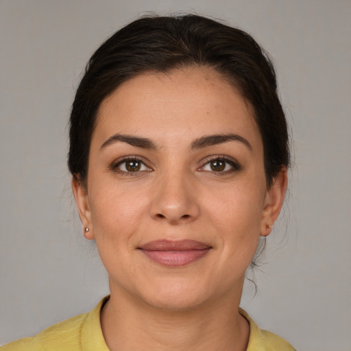 Joyful white young-adult female with medium  brown hair and brown eyes