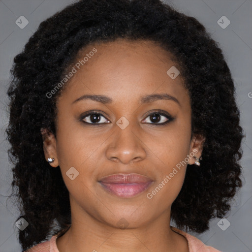 Joyful black young-adult female with long  brown hair and brown eyes