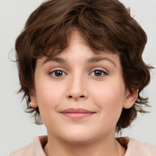 Joyful white child female with medium  brown hair and brown eyes