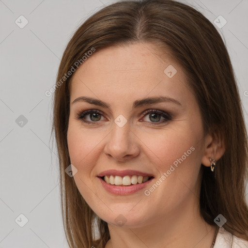 Joyful white young-adult female with long  brown hair and grey eyes