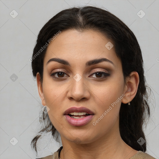 Joyful latino young-adult female with medium  black hair and brown eyes