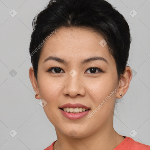 Joyful asian young-adult female with short  brown hair and brown eyes