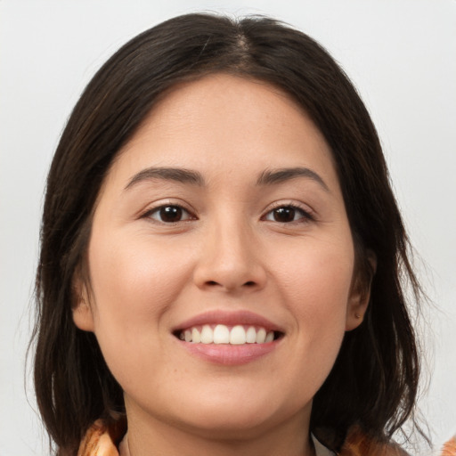 Joyful white young-adult female with medium  brown hair and brown eyes