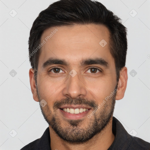 Joyful white young-adult male with short  black hair and brown eyes