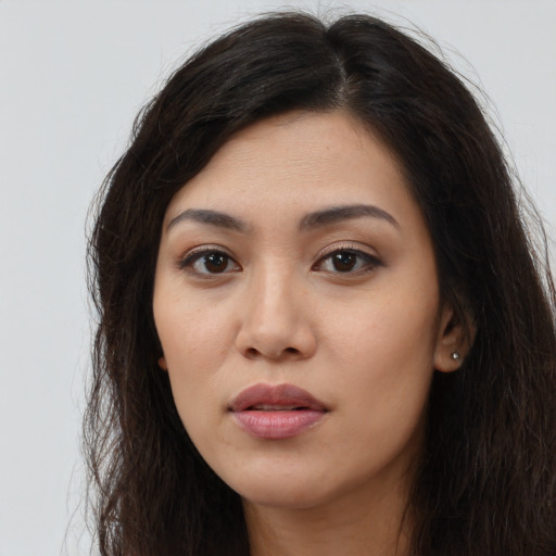 Neutral latino young-adult female with long  brown hair and brown eyes