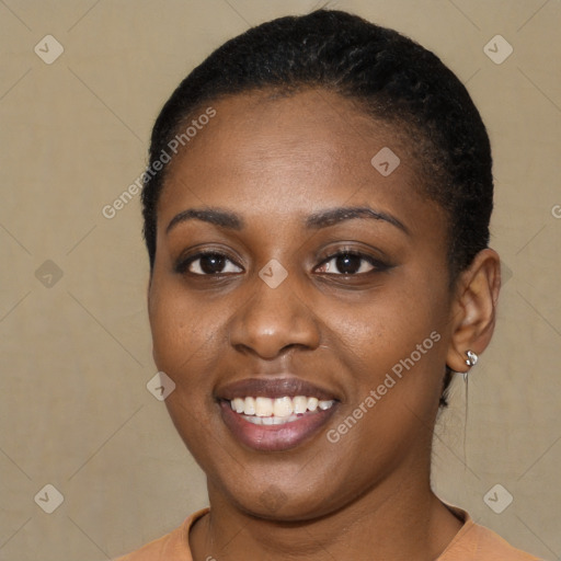 Joyful black young-adult female with short  brown hair and brown eyes