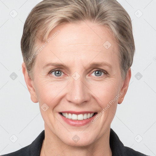 Joyful white adult female with short  brown hair and grey eyes