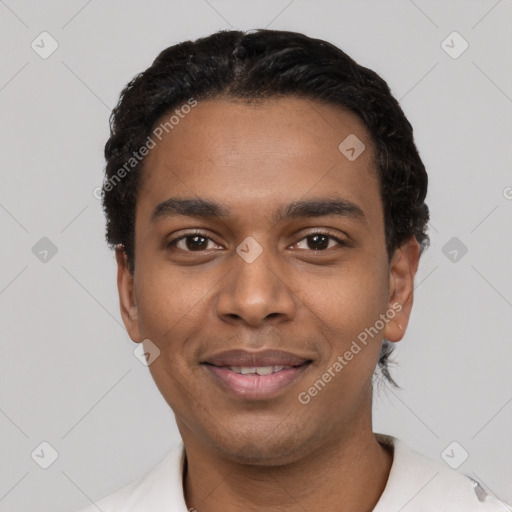 Joyful black young-adult male with short  black hair and brown eyes