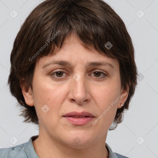 Joyful white adult female with medium  brown hair and brown eyes