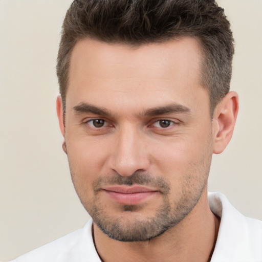 Joyful white young-adult male with short  brown hair and brown eyes