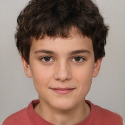 Joyful white child male with short  brown hair and brown eyes