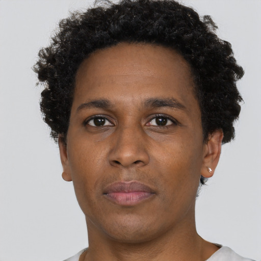 Neutral black adult male with short  brown hair and brown eyes