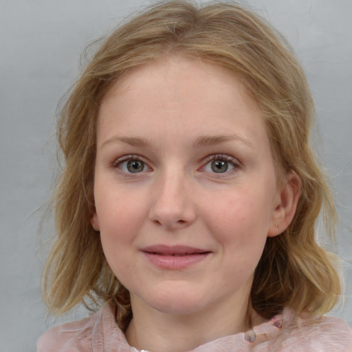 Joyful white young-adult female with medium  brown hair and blue eyes