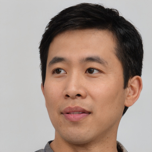 Neutral asian young-adult male with short  black hair and brown eyes