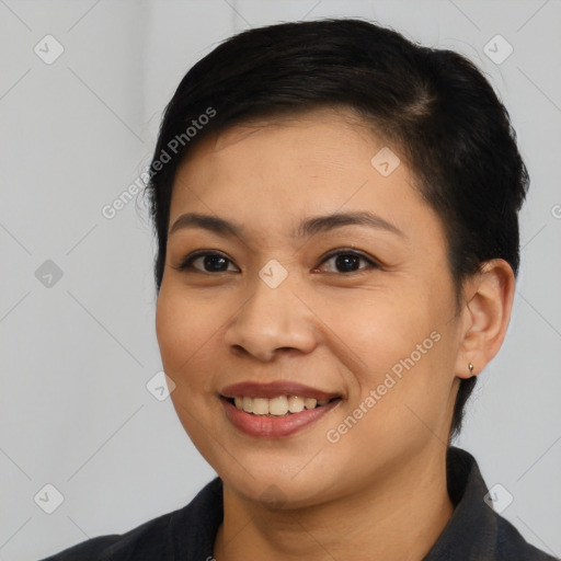 Joyful asian young-adult female with short  brown hair and brown eyes