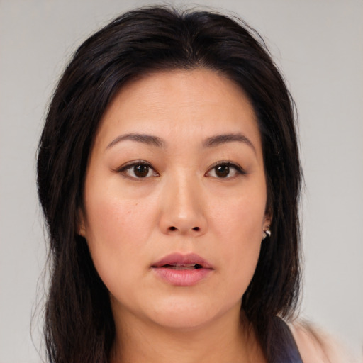 Neutral asian young-adult female with medium  brown hair and brown eyes