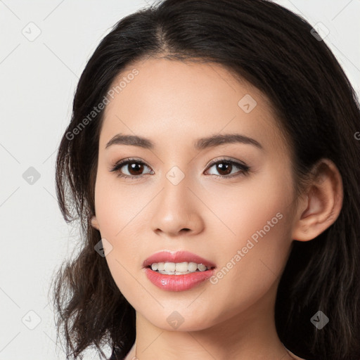 Joyful white young-adult female with long  black hair and brown eyes