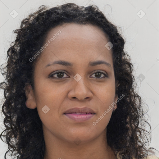 Joyful black young-adult female with long  brown hair and brown eyes