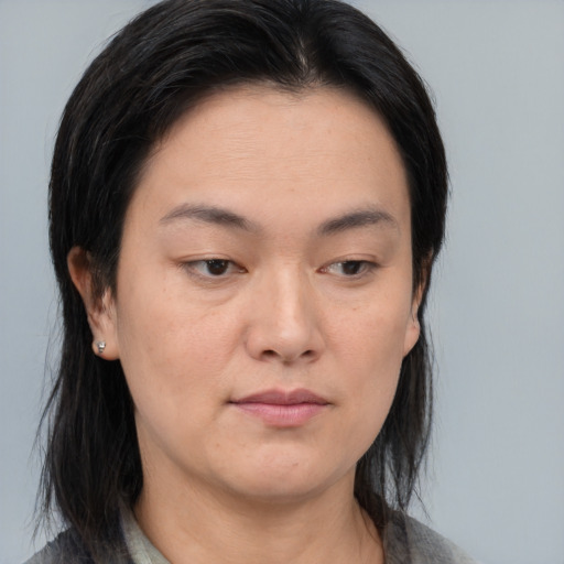 Neutral asian young-adult female with medium  brown hair and brown eyes