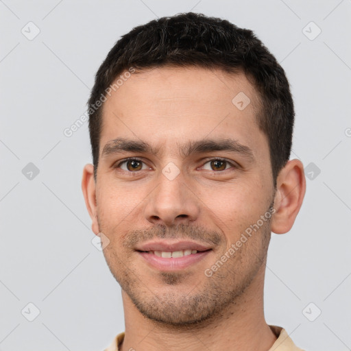 Joyful white young-adult male with short  brown hair and brown eyes