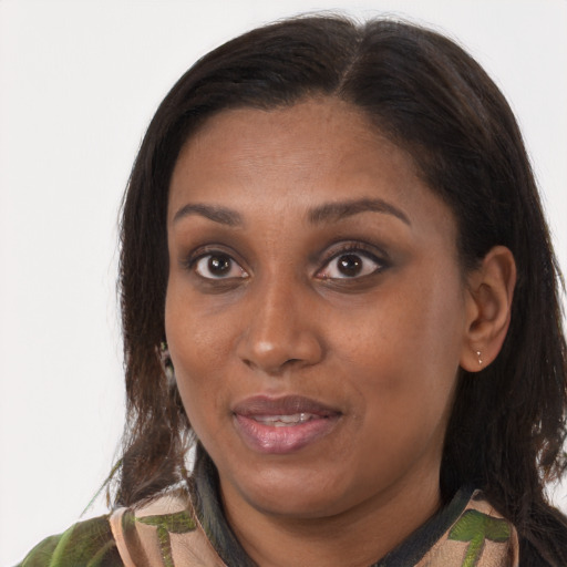 Joyful black young-adult female with medium  brown hair and brown eyes