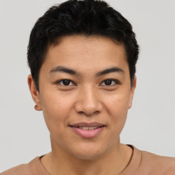 Joyful asian young-adult male with short  brown hair and brown eyes