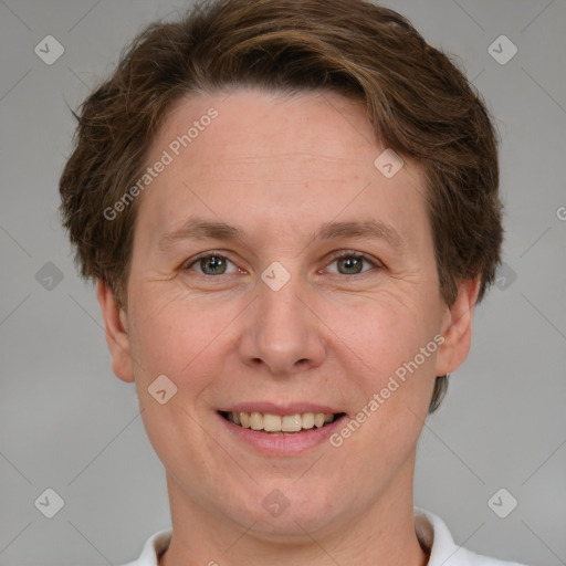 Joyful white adult female with short  brown hair and grey eyes