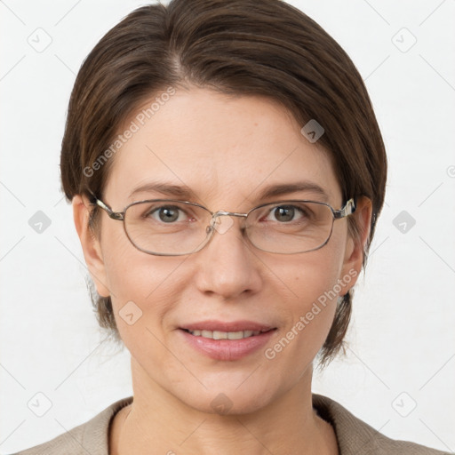 Joyful white adult female with short  brown hair and grey eyes